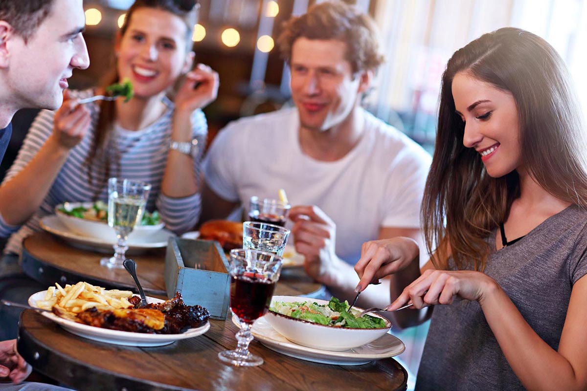 A group of friends enjoying their meal at the restaurant